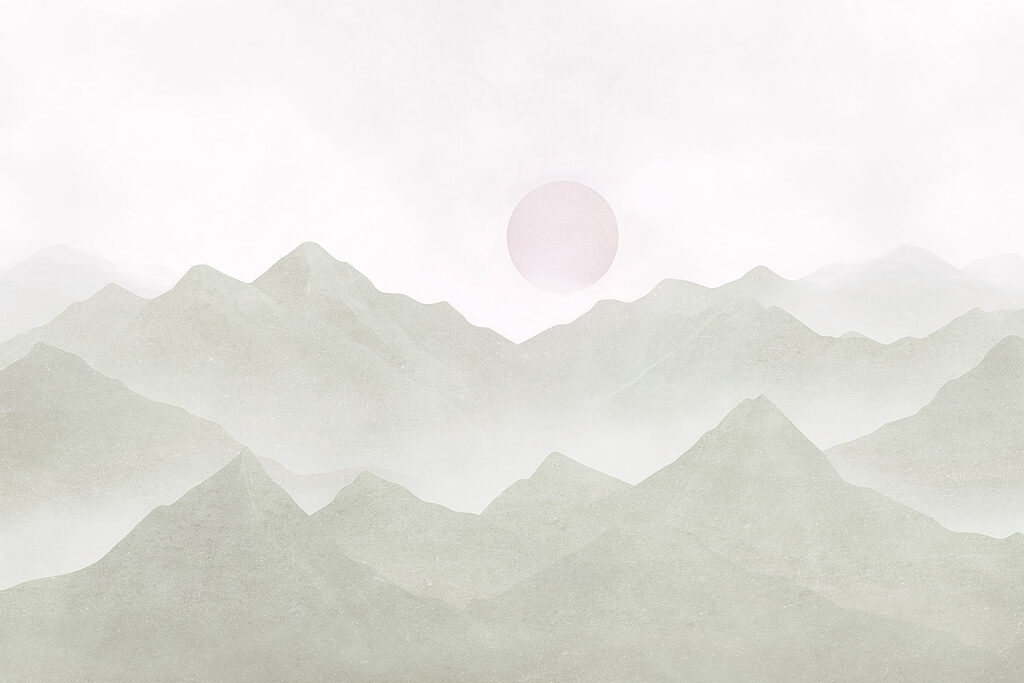 Mountain range with a sun in the distance