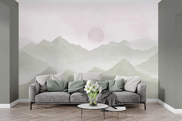 Mountain range with a sun in the distance