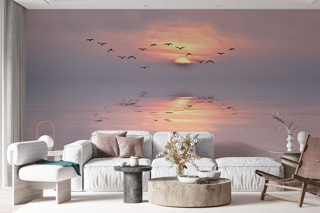 Flock of birds flying over water