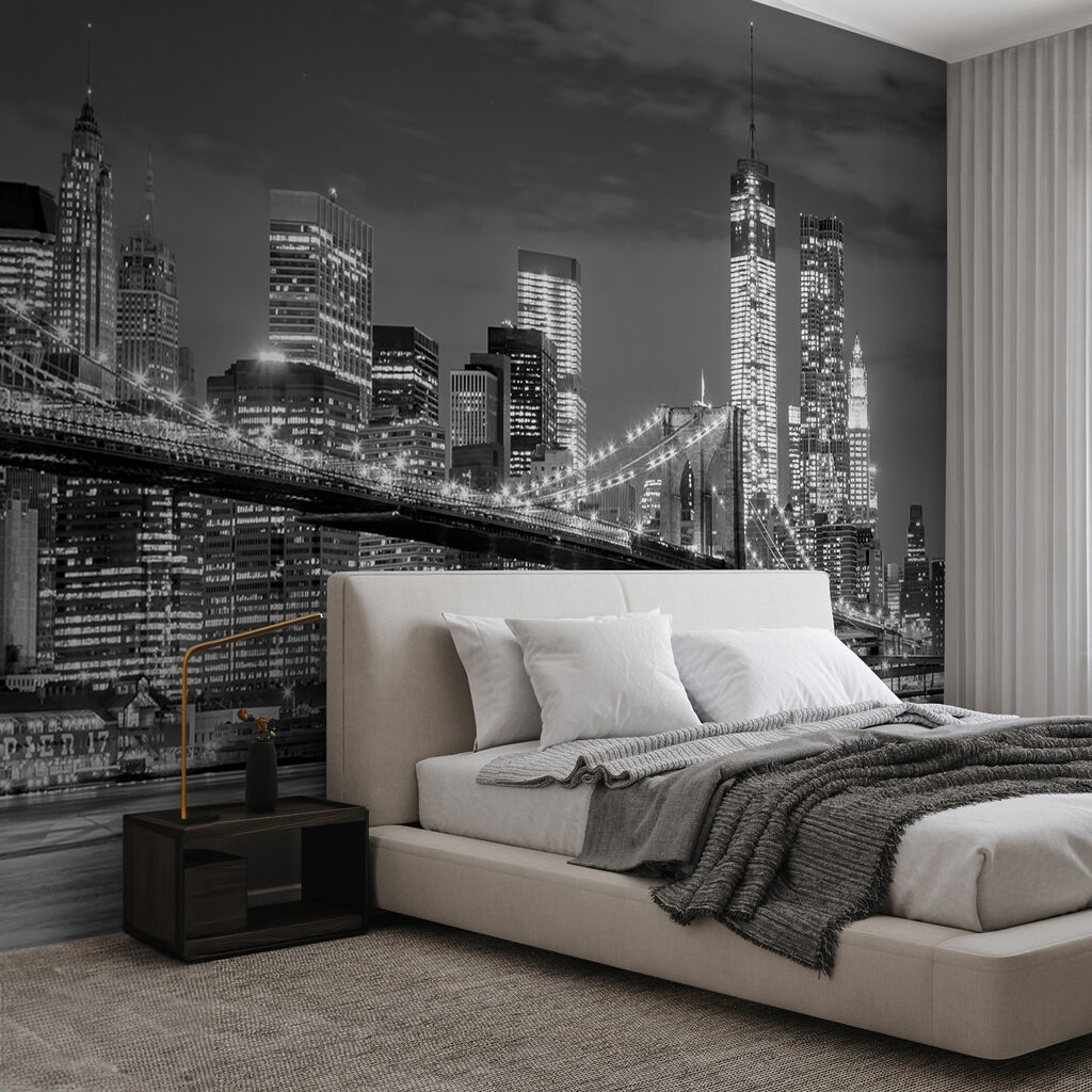 Bridge over water with city skyline at night