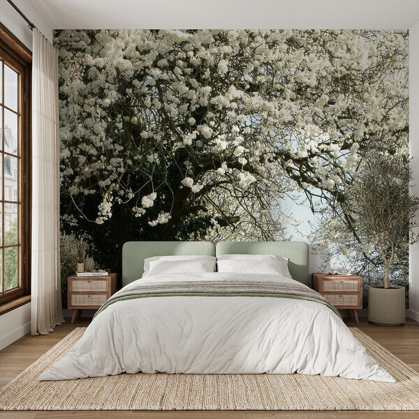 Dirt road with white flowers on it