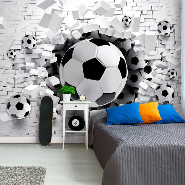 Football ball breaking through a brick wall Football ball breaking through a brick wall