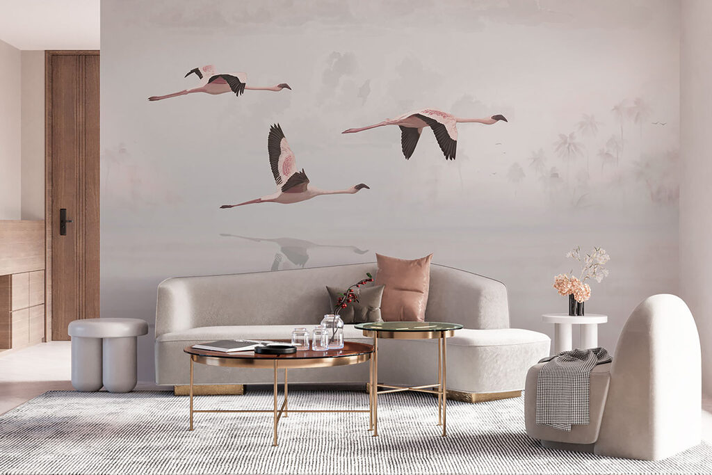 A group of flamingos flying over water