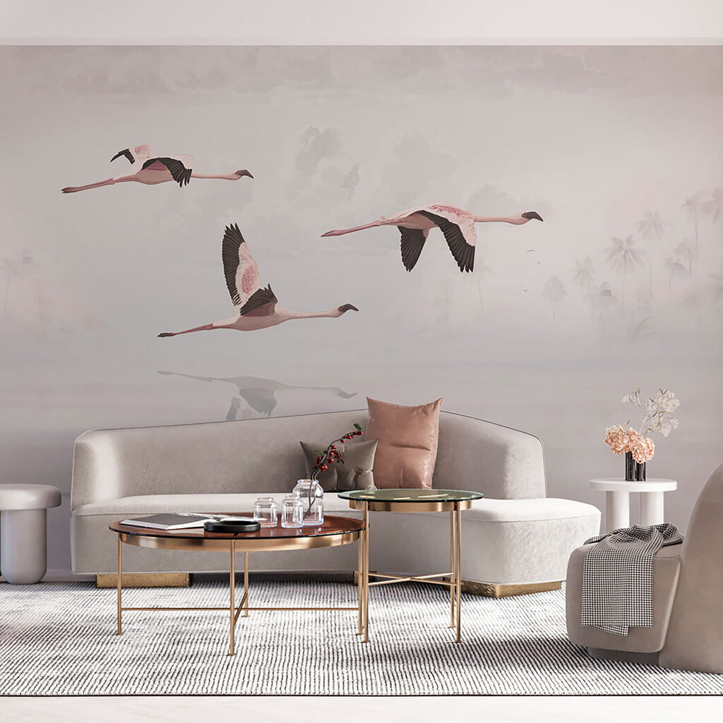 A group of flamingos flying over water