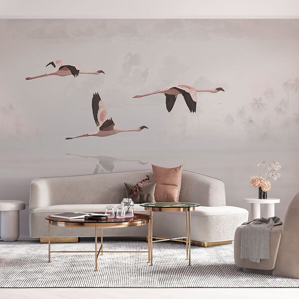 A group of flamingos flying over water