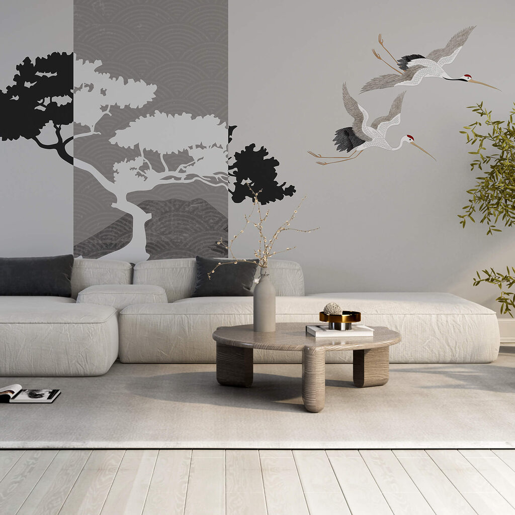 Couple of cranes flying next to a tree Couple of cranes flying next to a tree