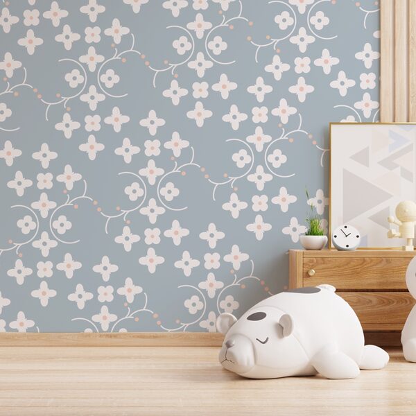 Pattern of white flowers and pink dots on a blue background