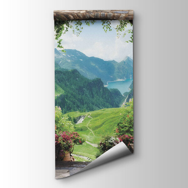 Stone archway with stone statues and a view of a valley and mountains