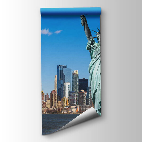 Statue of liberty with a city in the background