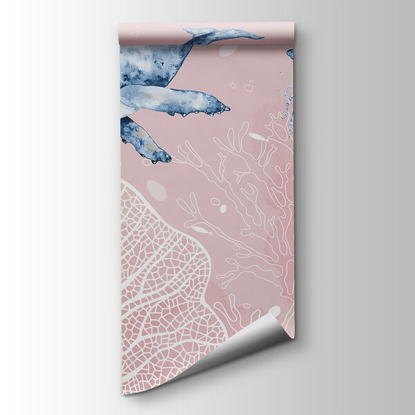 A whale and stingrays swimming in the ocean